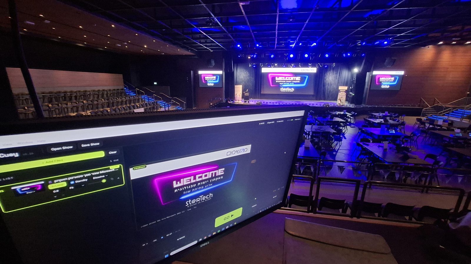 Cuey running a three-screen conference opening